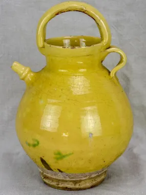 Antique French water pitcher with pale yellow glaze