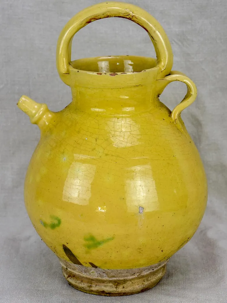 Antique French water pitcher with pale yellow glaze